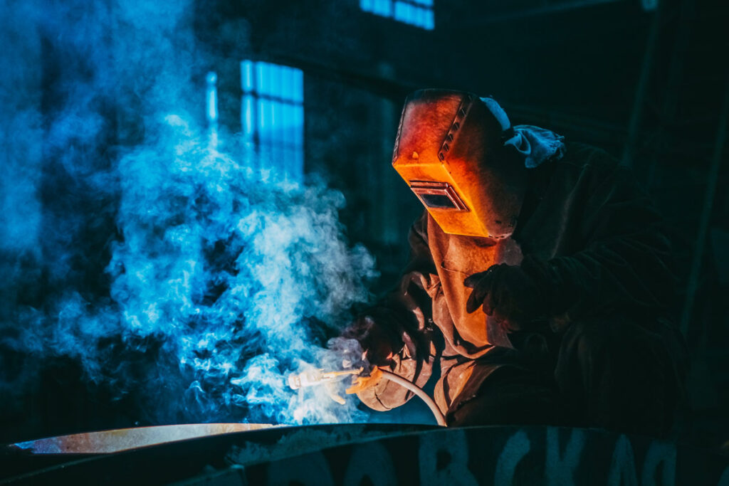 person-welding-wearing-a-prootective-metal-mask-3158651.jpg